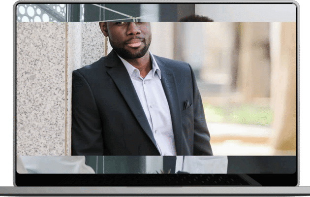 A man in a suit and tie intently gazes