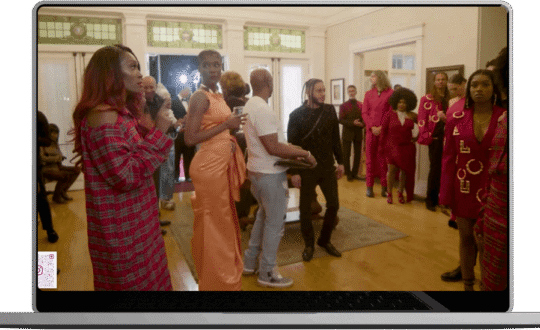 A woman stands confidently in front of a group of attentive people engaging them with her presentation